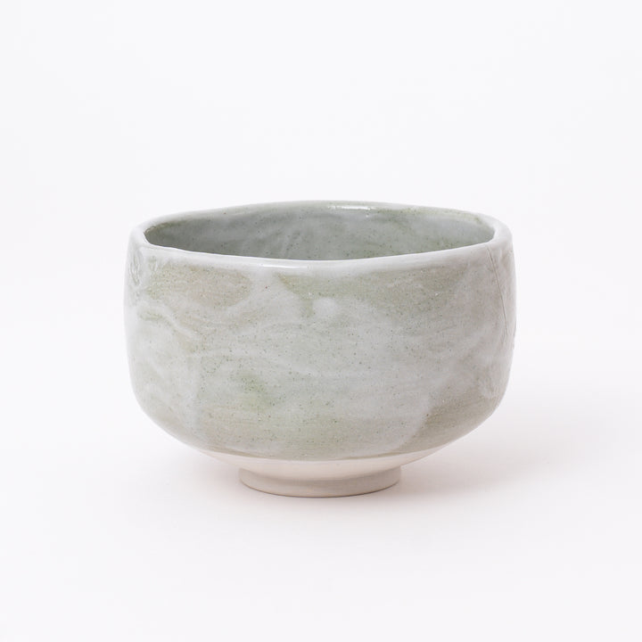Front view of a Japanese Mino Ware Green Shino Matcha Bowl featuring a soft sage green and ivory glaze.