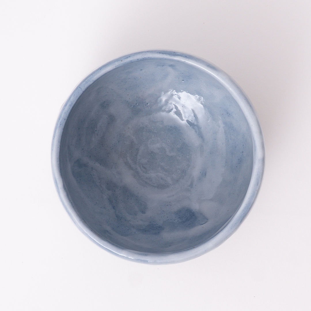 Close-up of the Ao Shino glaze with soft blue tones and natural kiln-fired variations on a handcrafted Mino Ware matcha bowl.