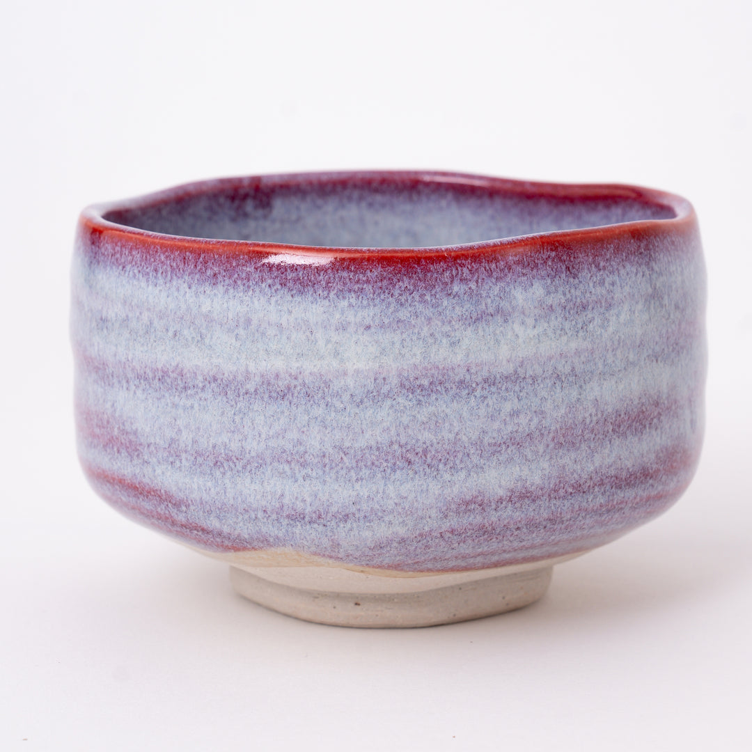 Close-up of the Sakura Unofu glaze with soft pink tones and natural kiln-fired variations on a handcrafted Mino Ware matcha bowl.