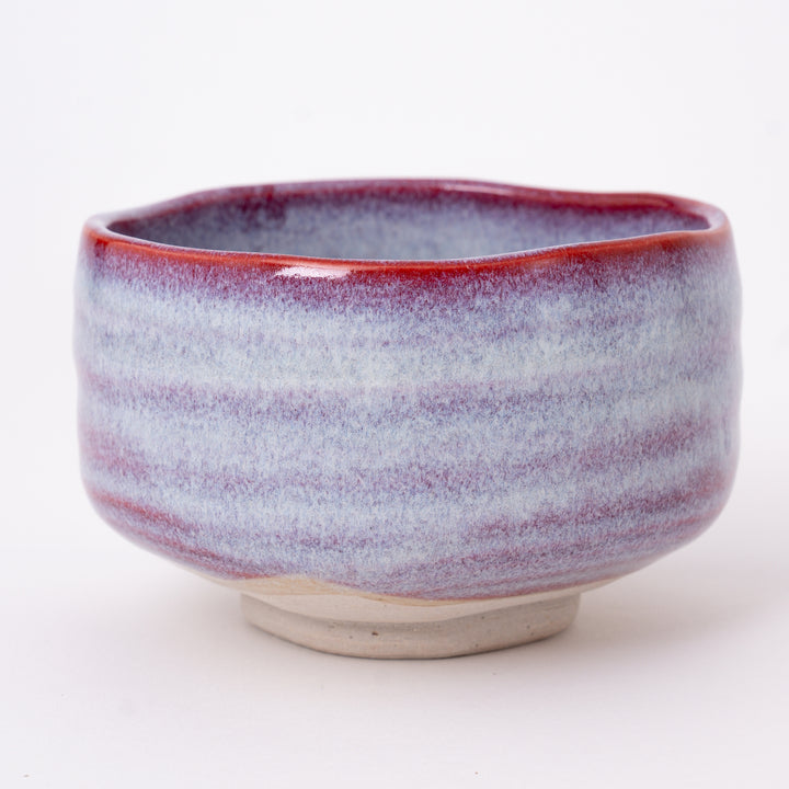 Close-up of the Sakura Unofu glaze with soft pink tones and natural kiln-fired variations on a handcrafted Mino Ware matcha bowl.