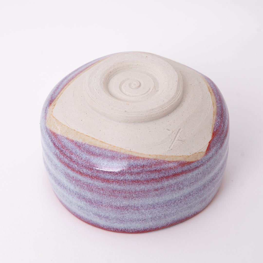Bottom view of a handmade Japanese Mino Ware ceramic matcha bowl showing the traditional foot ring and maker's mark.