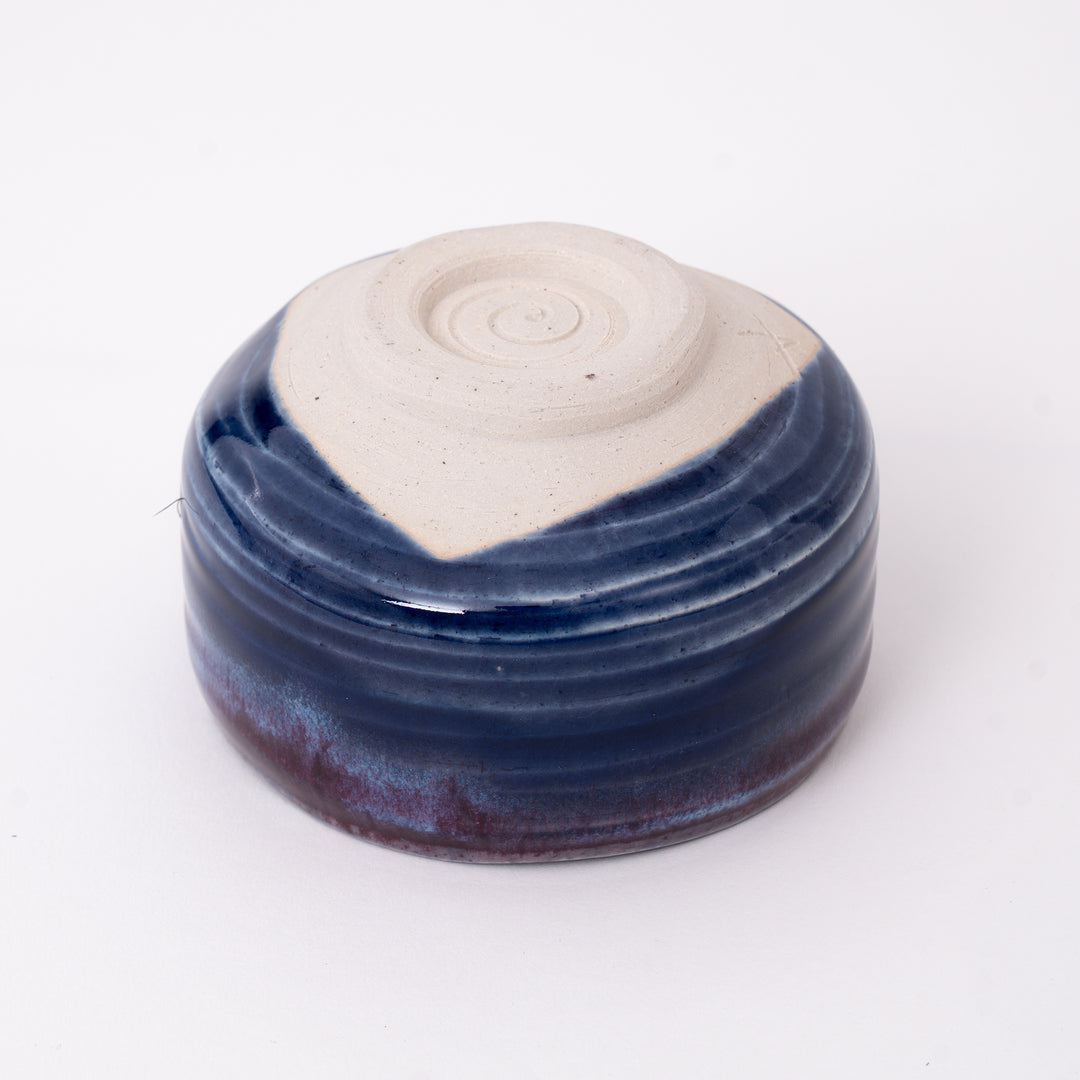 Bottom view of a handmade Japanese Mino Ware ceramic matcha bowl