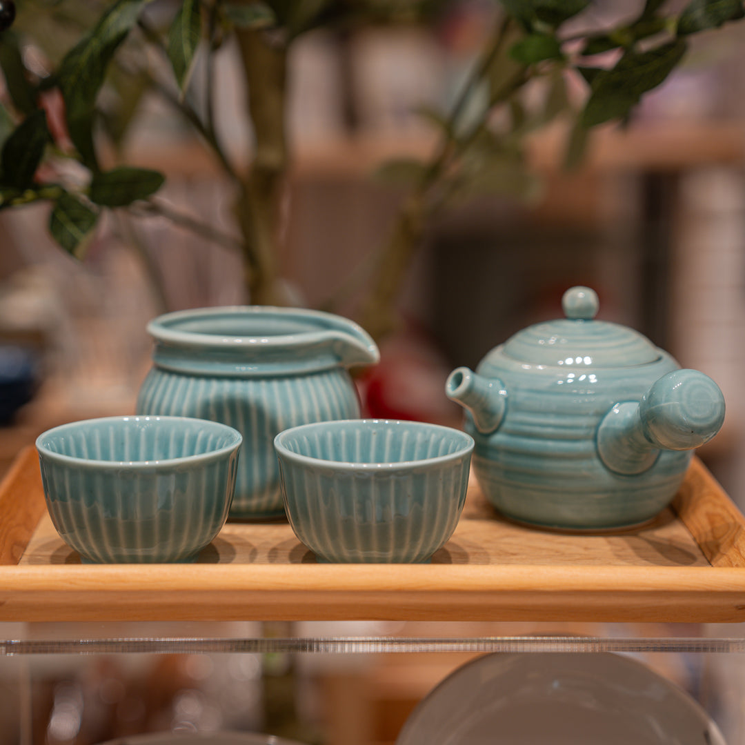 handmade blue teapot set with two tea cups and one pitcher