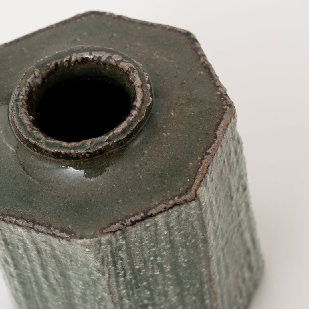 Close-up of green glaze and textured surface on Shigaraki mini vase