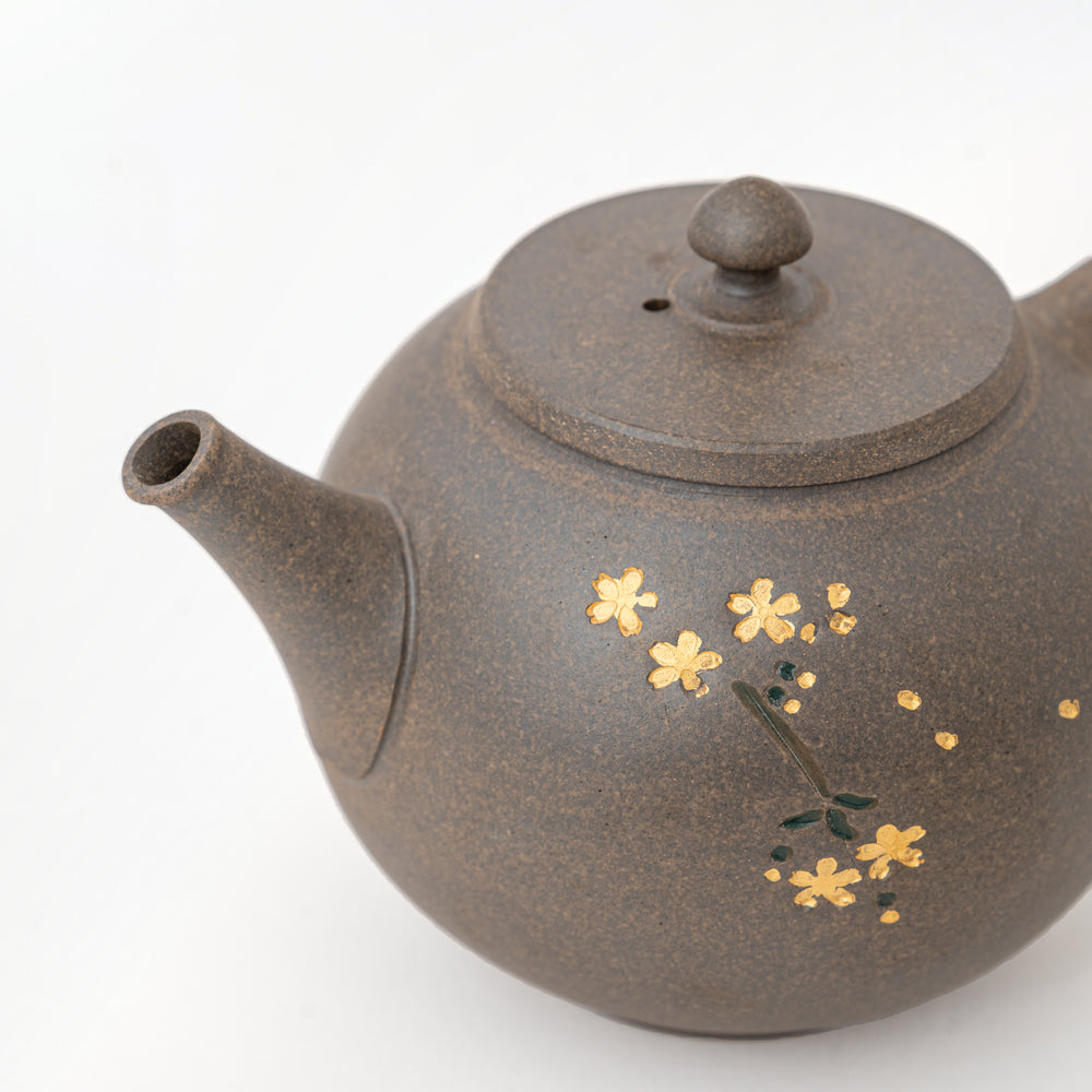 Cherry blossom and butterfly decorative motifs on Seiho ceramic teapot