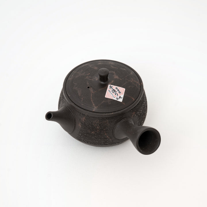 Rounded kettle-shaped Japanese kyusu in dark brown-black ceramic
