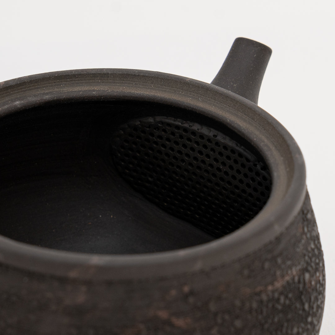 Black-brown Japanese pottery kyusu with rough pine bark surface