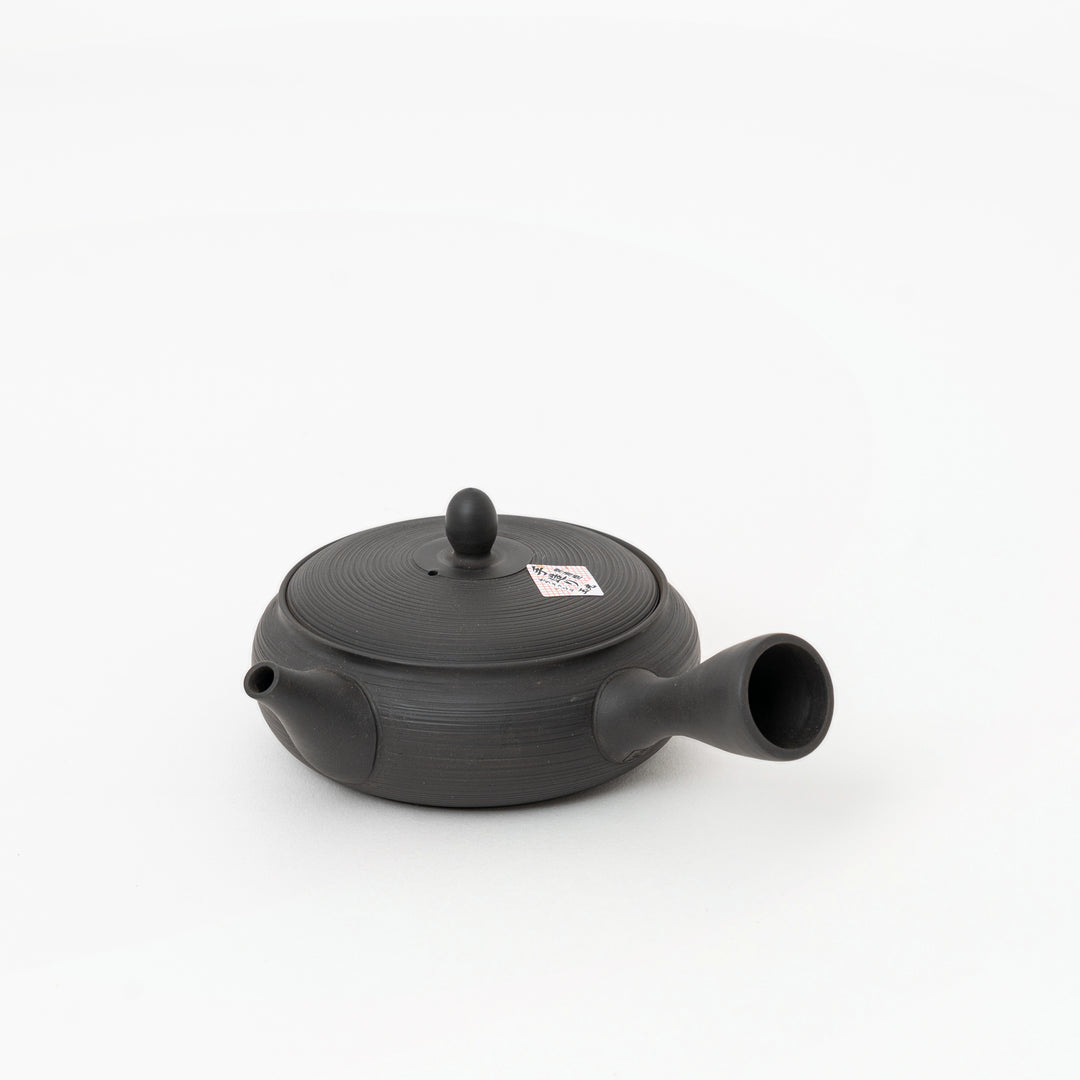 Gyokko Kiln black yohen kyusu showing flat ceramic teapot profile