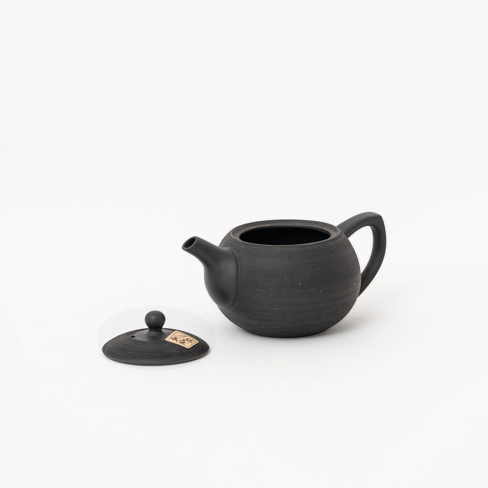 Black pine-bark-inspired Matsukawa surface on Japanese Tokoname teapot