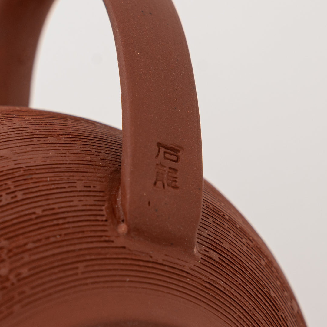 Traditional Tokoname ware reddish pottery tea pot with rear handle