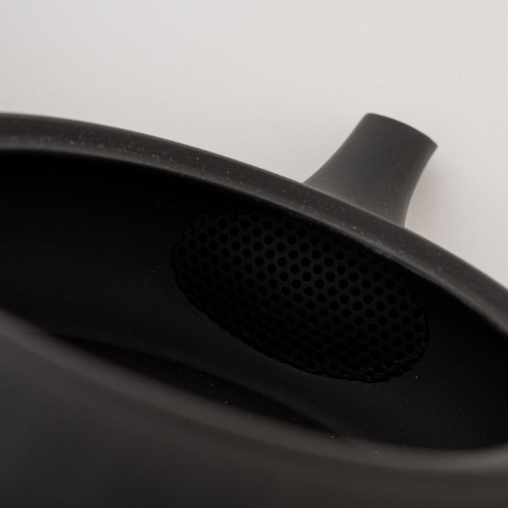 Black ceramic kyusu tea pot with shallow body and side handle