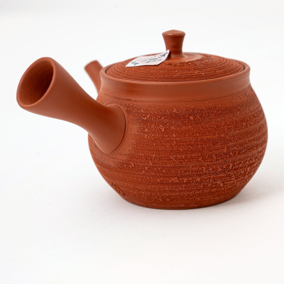 Japanese side-handle kyusu teapot with reddish-brown textured pottery