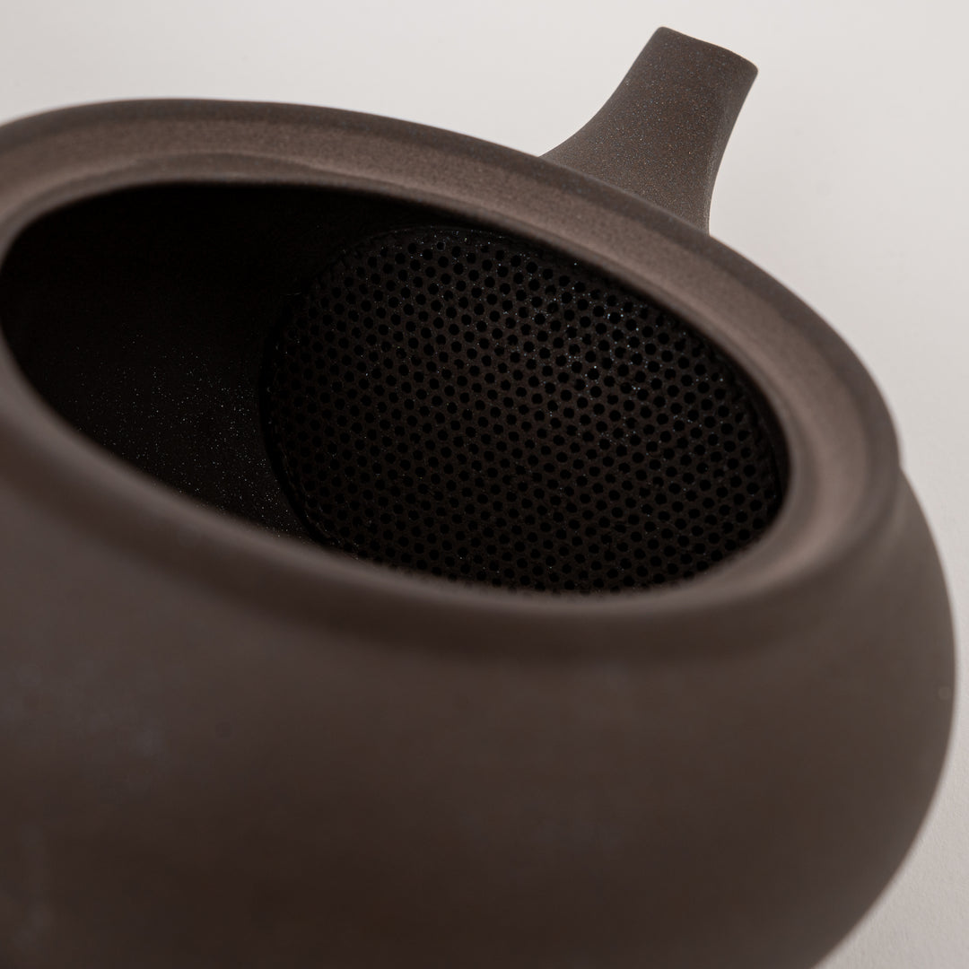 Brown ceramic kyusu teapot with traditional Japanese side handle