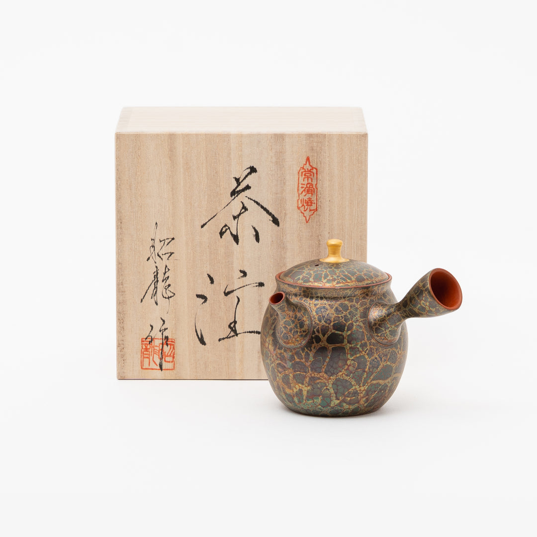 Close-up of a unique Tokoname teapot showing the rich, mottled texture and colors of Shoryu's original Tenmoku glaze