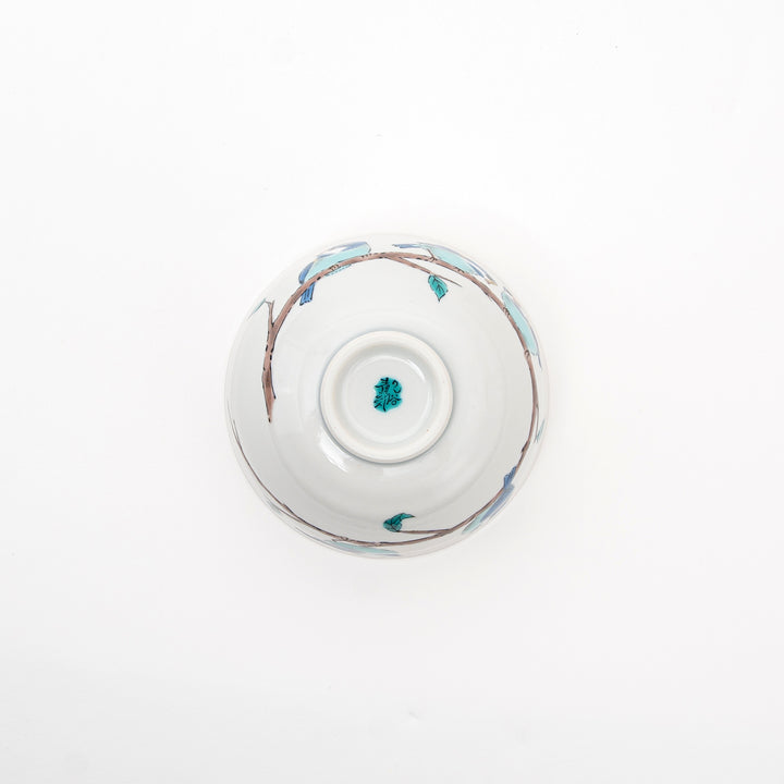 White ceramic bowl with decorative blue patterns on a white background