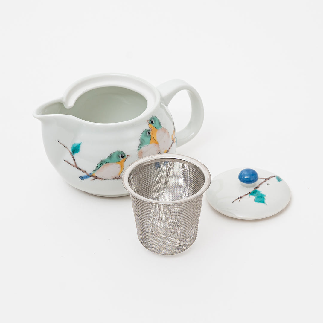 Kutani ware teapot with lid and removable stainless steel tea strainer

Japanese ceramic tea pot showing interior with bird artwork