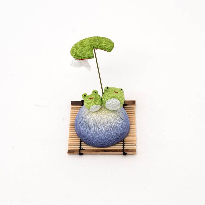 Handcrafted Ryukodo Japanese chirimen frog ornament with two green frogs on bamboo base