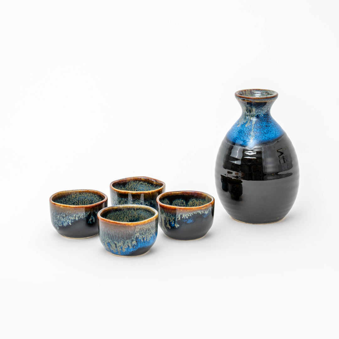 Japanese Tenmoku Mino ware sake set with black and cobalt-blue tokkuri bottle and four matching sake cups