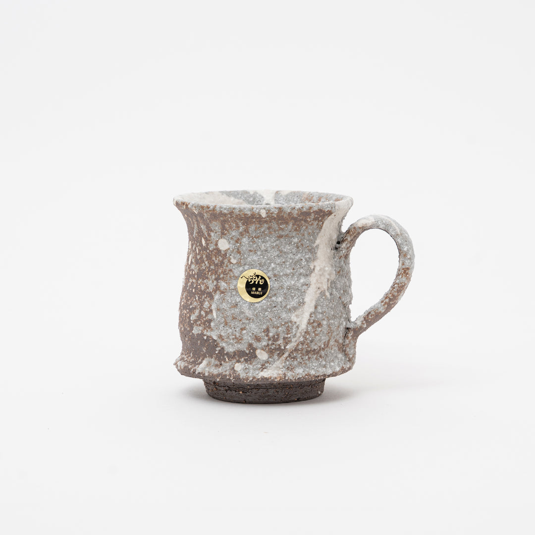 Handmade rustic Japanese Shigaraki Ware ceramic mug with volcanic ash glaze