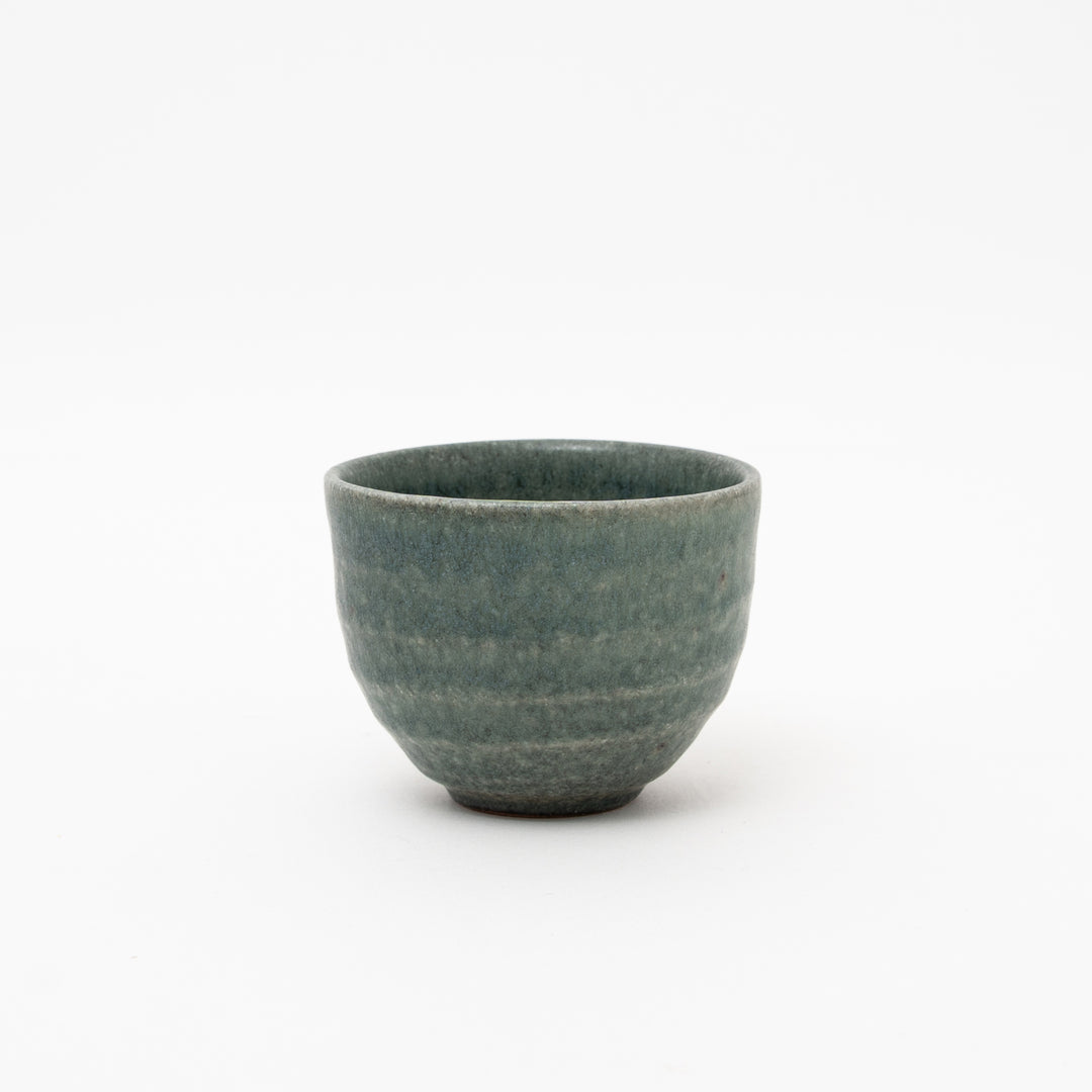 Handmade Japanese Shigaraki Ware Black Celadon ceramic teacup (yunomi) with textured, ribbed glaze