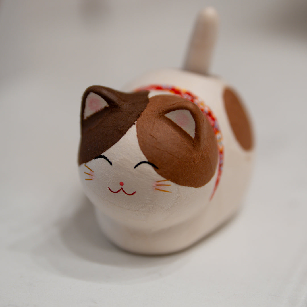 Handmade Japanese washi solar-powered tail-wagging cat figurine in Calico