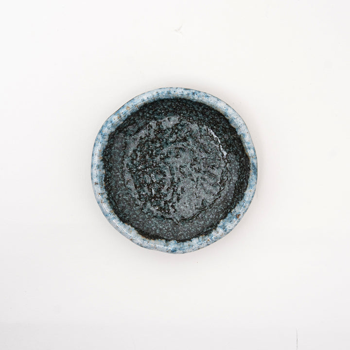 Close-up of the speckled blue glaze on a Japanese pottery dish