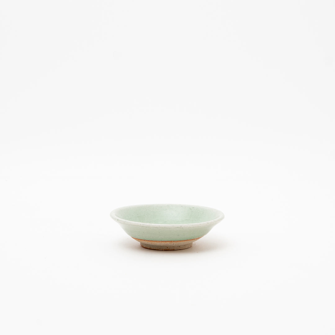 Side view of a small celadon bowl from Japan