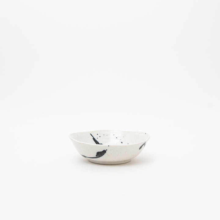 Handmade Japanese small bowl with Kuresu-nagashi cobalt blue glaze pattern on cream ceramic surface