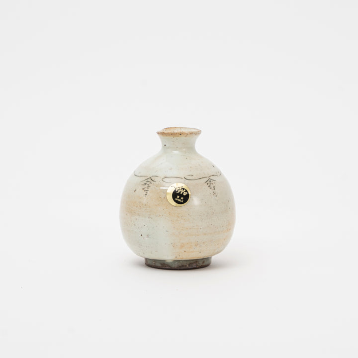 Close-up of rustic Japanese Shigaraki Ware mini vase with Kohiki white slip glaze and subtle hand-painted lines, approx 9 cm tall.