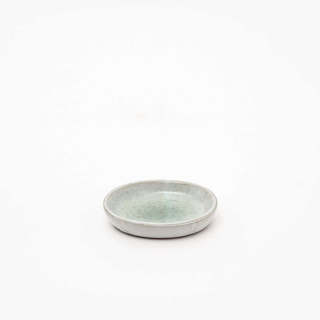 Authentic Japanese red clay ceramic dish with organic oval shape and mesmerizing speckled glaze pattern