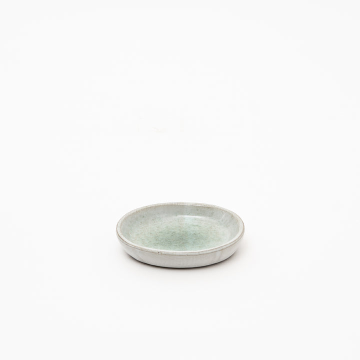 Authentic Japanese red clay ceramic dish with organic oval shape and mesmerizing speckled glaze pattern